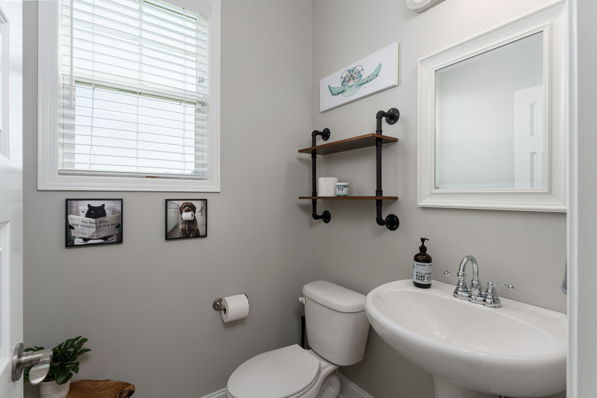 Downstairs half bath with pedestal sink